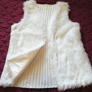 White fuzzy vest